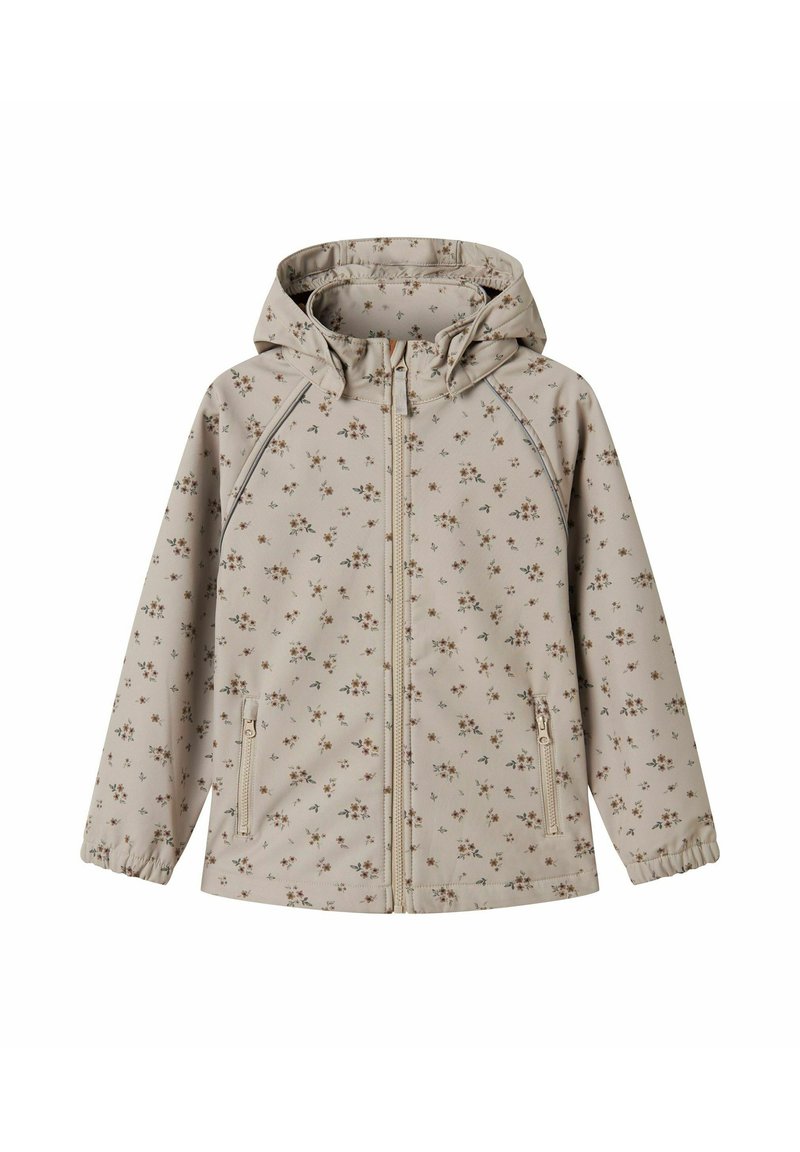 Lys beige jakke med blomstermønster. Har hette, glidelås foran, elastiske mansjetter og to sidelommer med glidelås. Glatt, strukturert stoff.