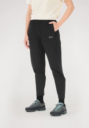 Black, lightweight, tapered trousers with an elastic waistband, featuring side pockets and a small logo on the left leg.