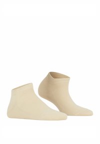 Beżowe skarpetki do kostek z miękkiego materiału, z prążkowaną gumką u góry i gładką strukturą oraz bezszwowym wykończeniem palców dla wygody.