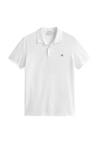 White short-sleeve polo shirt with collar, two-button placket, and small embroidered shield logo on left chest.