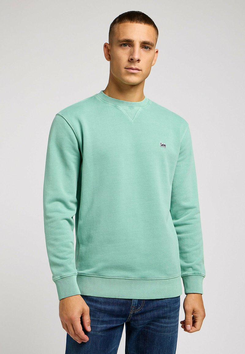 Miętowa bluza z bawełnianej mieszanki, okrągły dekolt, ściągacze na rękawach i dolnej krawędzi, z małym czarnym logo "Lee" na klatce piersiowej.