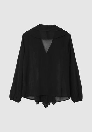 Blouse en chiffon noir à manches longues, grand col et découpe en V dans le dos. Texture légère et transparente, coupe ample.