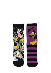 Calzini neri e viola con personaggi dei cartoni animati: il calzino sinistro ha diversi personaggi, mentre il calzino destro presenta un motivo a righe e Daffy Duck.