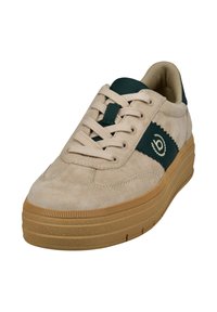 Beige suede sneaker with a green leather accent and logo. Features lace closure, padded collar, and gum rubber sole with textured grip.