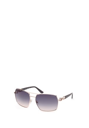 Lunettes de soleil rectangulaires avec des verres gris dégradés. Monture en métal doré, branches noires et accents de quincaillerie décoratifs.