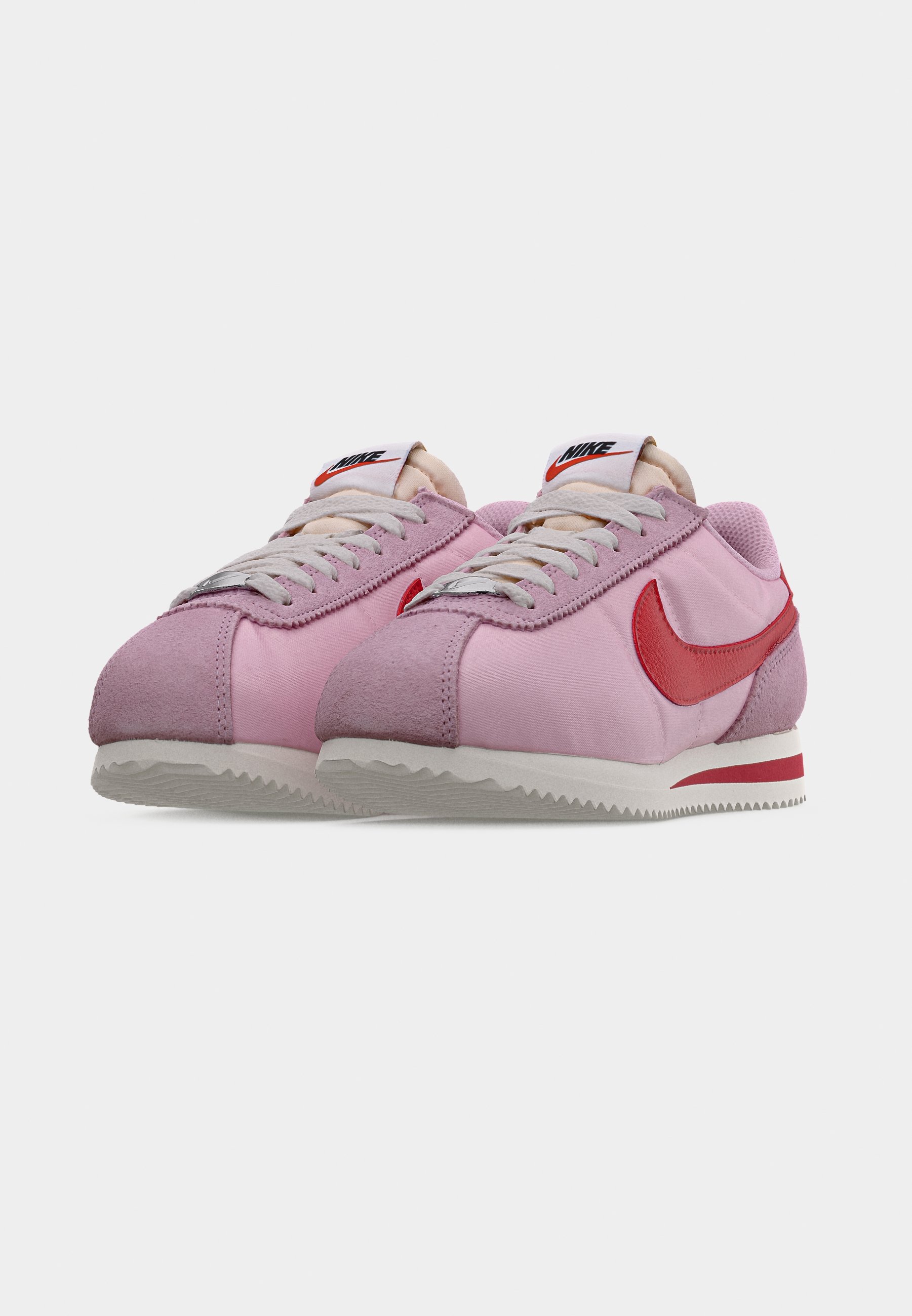 pink and red nike cortez