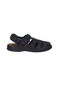 Black open-toe sandal made of leather, featuring slotted design, adjustable strap, and contrast stitching. Thick rubber sole provides stability.