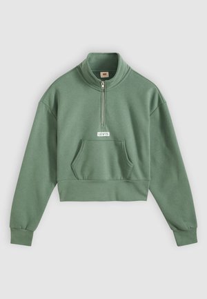 Zielona krótka bluza z zamkiem przy stójce, długimi rękawami i przednią kieszenią. Na piersi znajduje się biała naszywka z logo Levi's.