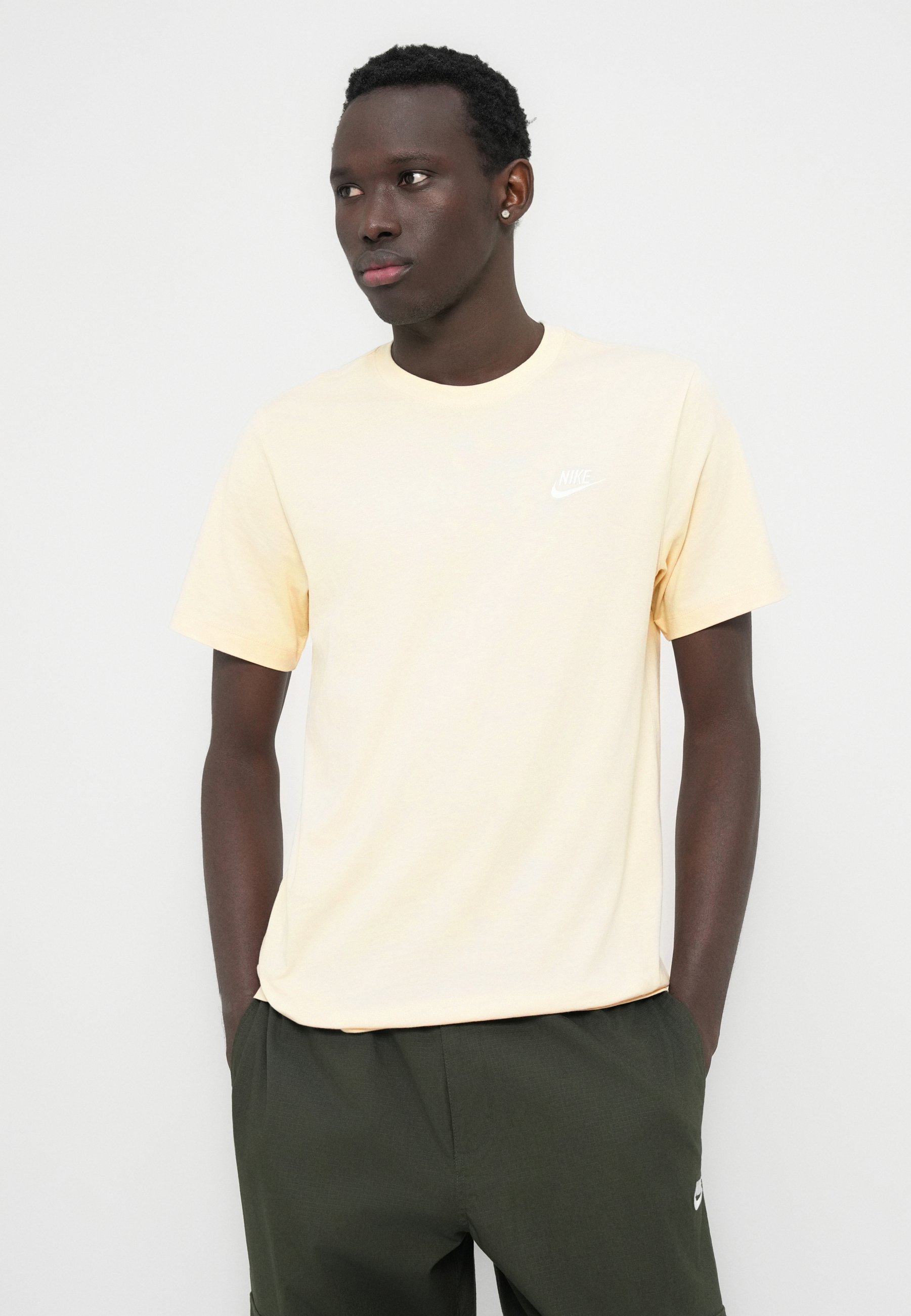 pastel yellow nike shirt