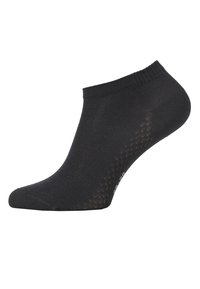 Chaussette noire jusqu'à la cheville en tissu lisse, avec une bordure côtelée et un motif texturé à pois sur les côtés. Idéale pour une tenue décontractée.