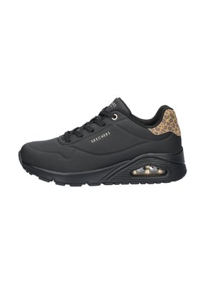 Black athletic shoe with a smooth upper, textured leopard print accent on the heel, and visible air cushioning in the outsole.
