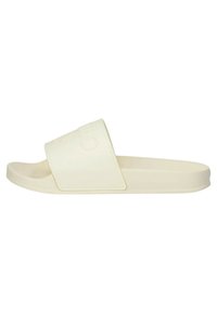Infradito beige realizzati in materiale morbido, con una fascia larga, design minimalista e soletta sagomata per il comfort.
