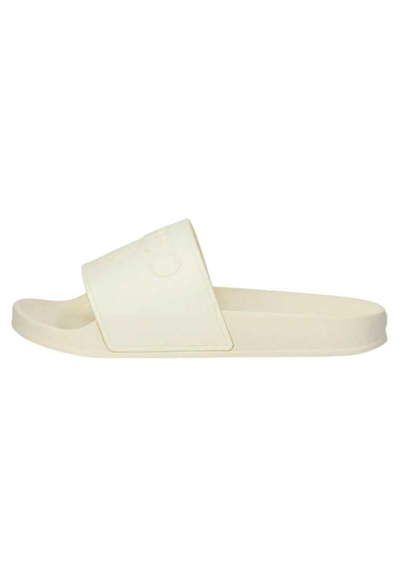 Infradito beige realizzati in materiale morbido, con una fascia larga, design minimalista e soletta sagomata per il comfort.