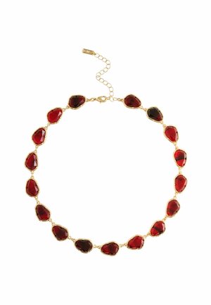 Gold chain necklace with irregularly shaped deep red gemstones and an adjustable clasp on a white background.