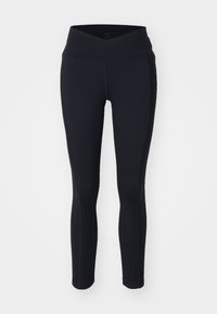 Fekete leggings magas, keresztbe tett derékkal. Rugalmas anyagból készült, diszkrét varrási részletekkel. Szoros illeszkedésű kialakítás.