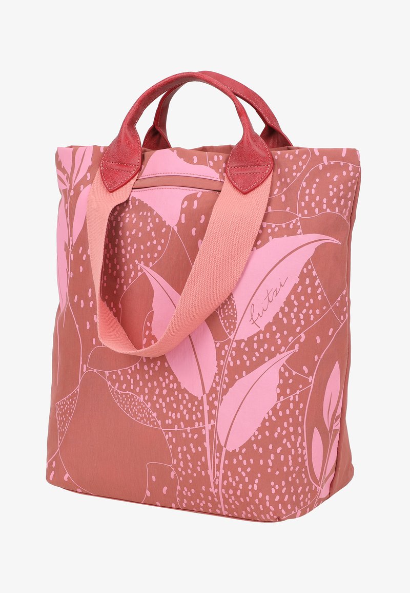 Bolsa tote reutilizable en rosa y terracota, con un patrón de hojas, tela suave, asas dobles con acentos contrastantes y cierre superior con cremallera.