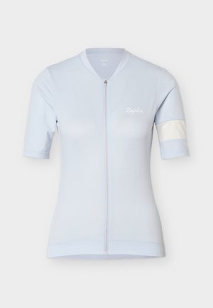 Helehelesinine lühikeste varrukatega jalgratturite särk täispika esilukuga, õrnade horisontaalsete triipudega, Rapha logo rinnal ja valge triibuga vasakul varrukal.