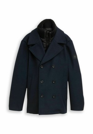 Manteau bleu marine à double boutonnage en tissu texturé, doté d'un col montant, d'une doublure intérieure noire et de boutons noirs.