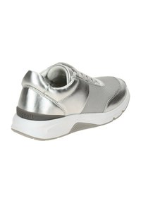 Silver athletic shoe with a mesh upper, metallic accents, and a white rubber sole. Features padded collar and lacing. Note logo detail.