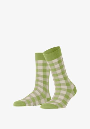 Grüne und weiße kariert Socken mit einem gerippten grünen Bund. Weicher Stoff mit kontrastierenden Mustern, entworfen für Komfort und Stil.