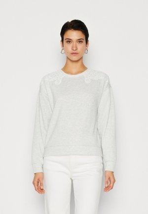 Light gray sweatshirt with a round neckline, featuring decorative white lace accents on the shoulders and ribbed cuffs and hem.