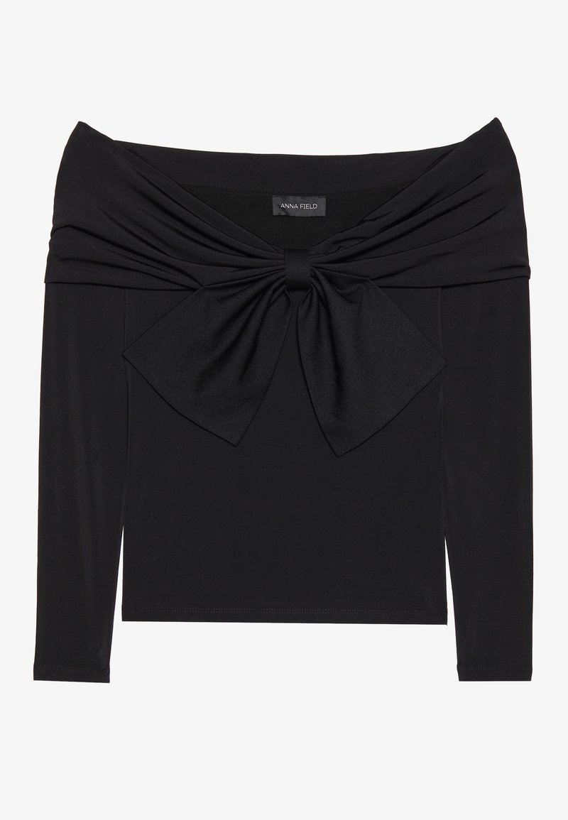 Schwarzes Langarmoberteil mit schulterfreier Ausschnittform, gedrehtem Stoffdesign an der Brust und einer großen Schleifendetail vorne.