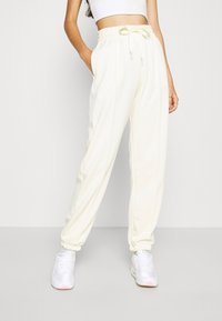 Nike Sportswear Träningsbyxor - off-white