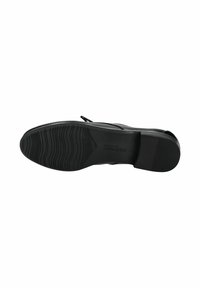 Suola di scarpa nera con una presa testurizzata in gomma. Presenta un design piatto e accenti minimi e lisci. Leggera con una forma arrotondata.