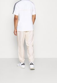 adidas Originals Kalhoty - off-white