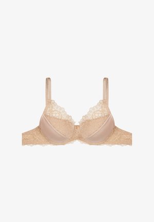 Beżowy stanik koronkowy z kwiatowym wzorem, z wypełnionymi miseczkami i regulowanymi ramiączkami. Charakteryzuje się miękkim satynowym wykończeniem i koronkowym wykończeniem na brzegach.