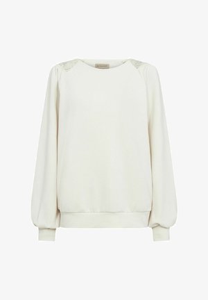 Hele kreemjas sviiter puff-sleeved varrukatega, pitsdetailid õlgadel, soonikud mansettidel ja allääres, ning ümmargune kaelus. Pehme kangastekstuuri.