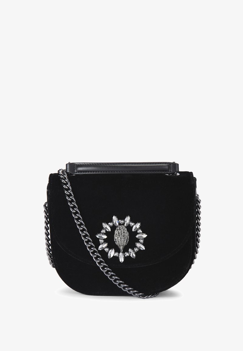 Black velvet crossbody bag with a silver chain strap, featuring a decorative silver hand motif surrounded by clear gemstones.
