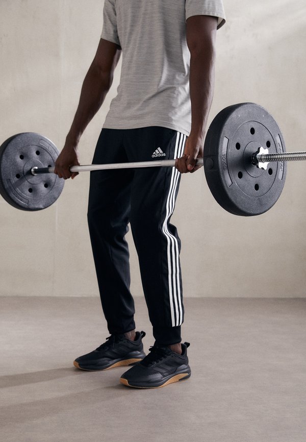 ESSENTIALS 3-STRIPES - Tracksuit bottoms