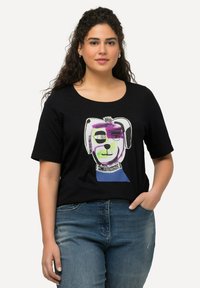 Černé bavlněné tričko s kulatým výstřihem a krátkými rukávy, s barevným potiskem obličeje psa. Pohodlný střih.