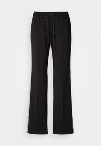 Pantalons de sport noirs en tissu texturé, avec une taille réglable à cordon et des stries blanches sur les côtés. Coupe ample avec des jambes droites.