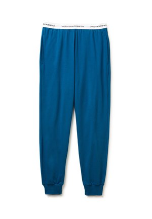 Pantalones de chándal azules con una cintura elástica blanca etiquetada "United Colors of Benetton". Cuenta con bolsillos laterales y puños fruncidos en los tobillos.