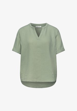 Jasnozielona krótka bluzka z teksturowanej tkaniny, z dekoltem w kształcie litery V i zaokrąglonym dołem, zaprojektowana do noszenia na co dzień.