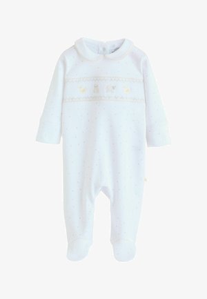 Witte babyromper met lichte polkadots, een afgeronde kraag en een geplooide band met geborduurde dieren in zachte pasteltinten.