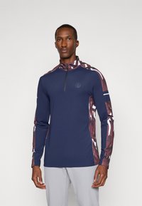 Navy long-sleeve top with half-zip, featuring patterned maroon and white accents on sleeves. Smooth texture with a slim fit design.
