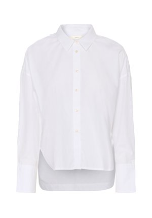 Bílá košile s dlouhým rukávem na knoflíky, s špičatým límcem, mírně delším zadním lemem a velkými manžetami.