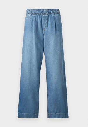 Svetlo modré denimové nohavice s elastickým pásom, širokým strihom a jemnou textúrou. Nemajú viditeľné vrecká ani ozdoby.