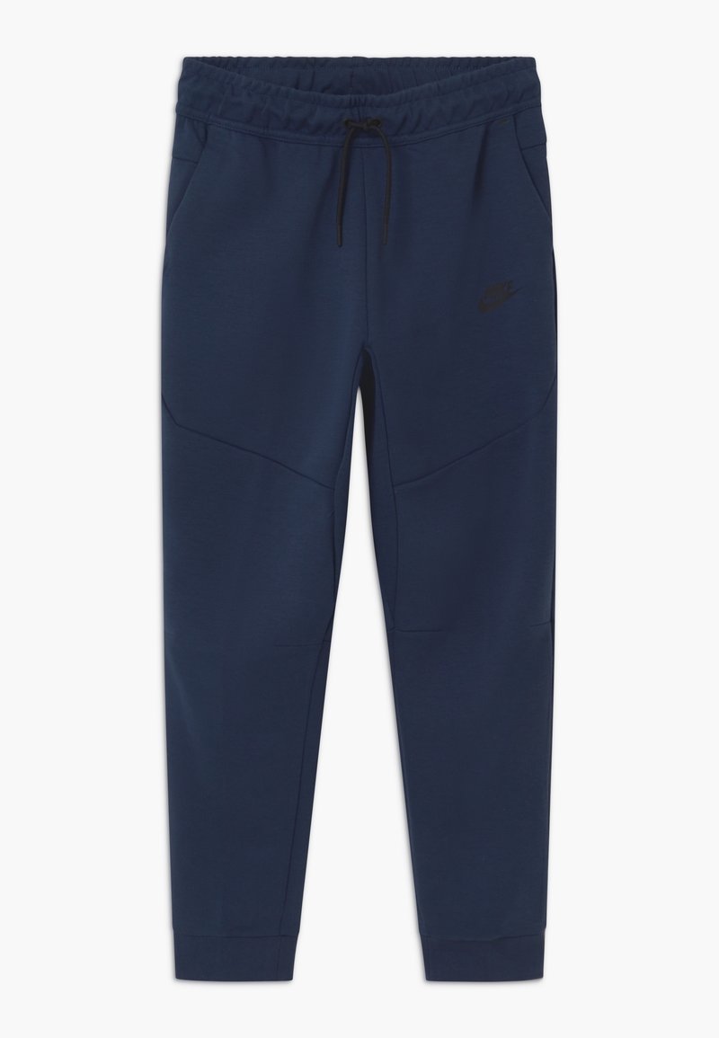 Mörkblå Nike-mjukisbyxor tillverkade av mjukt tyg, med ett elastiskt midjeband med snörning, sidfickor och avsmalnande ben.