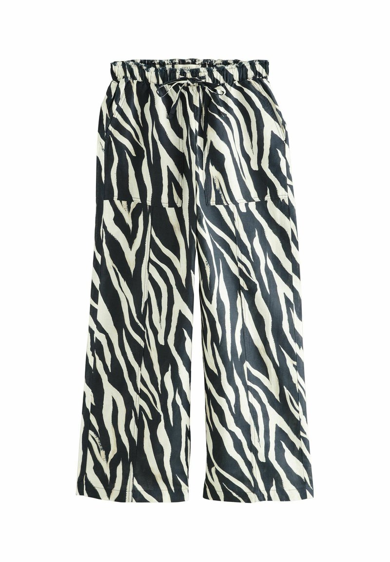 Pantalons larges en imprimé zèbre noir et blanc, avec une taille élastique à cordon et deux poches avant. Tissu léger.
