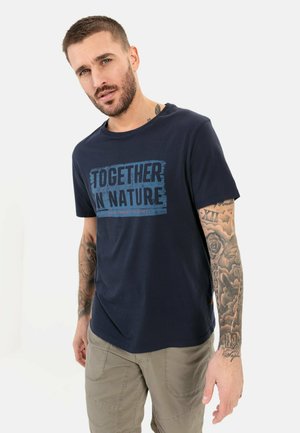 Navy blue cotton t-shirt featuring a graphic print with the text "TOGETHER IN NATURE" in light blue, round neckline, relaxed fit.