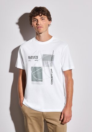 White cotton t-shirt featuring abstract graphic design in gray and green with text. Round neck, short sleeves, and relaxed fit.