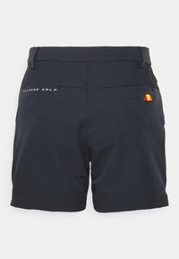 Shorts de golf bleu marine avec une texture lisse, arborant un logo "Aless GOLF" blanc et un petit emblème multicolore sur la poche arrière.