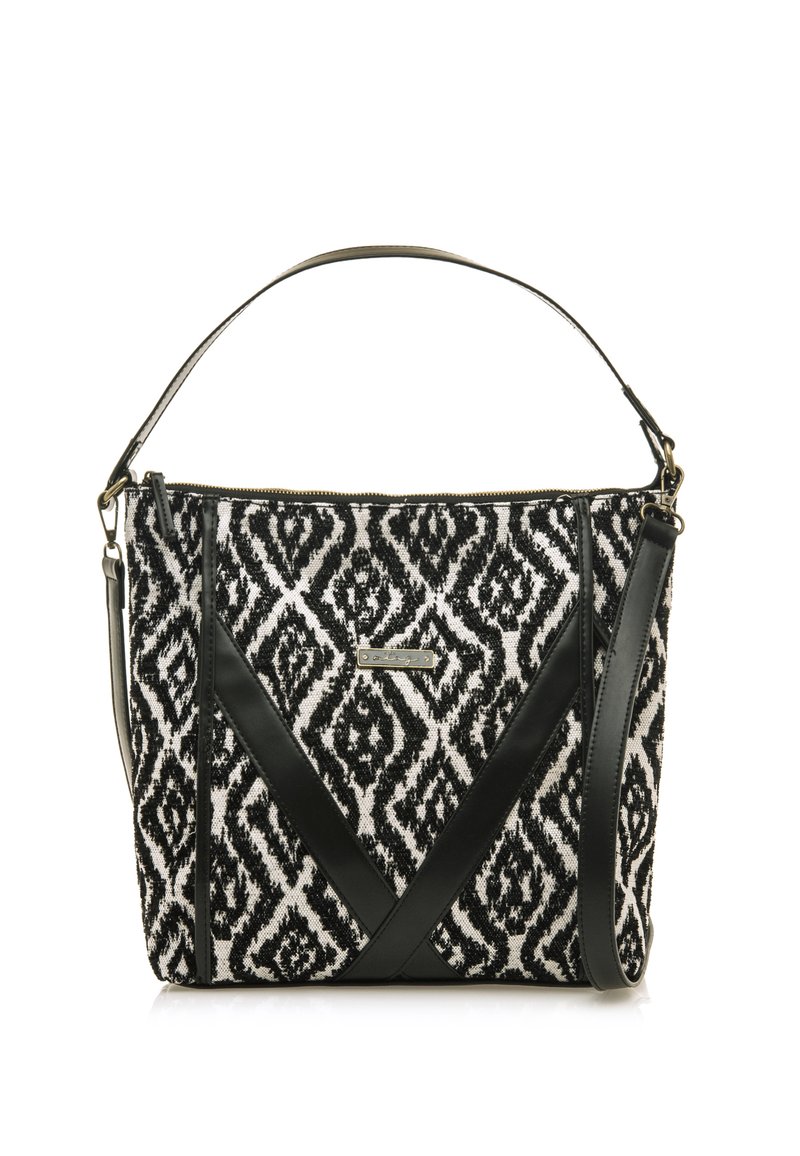 Sac à main en tissu à motifs noir et blanc avec un design structuré, présentant des accents en cuir noir et une bandoulière amovible.