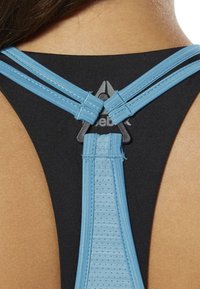 Black athletic tank top featuring light blue adjustable straps with textured detailing and a black logo at the back.