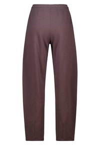 Bruine sweatpants met een ontspannen pasvorm, een elastische tailleband en inkepingen aan de zoom voor gemakkelijke beweging. Zachte stoftextuur.