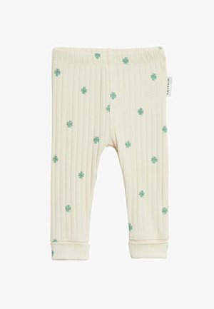 Cremefarbene, gerippte Baby-Leggings mit kleinen grünen Blumenmustern und einem elastischen Bund.